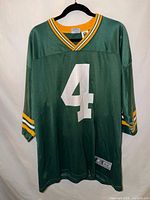 Full front view of green Brett Favre #4 Packers jersey on hanger