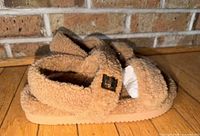 Top view of tan sherpa Steve Madden slide sandals
