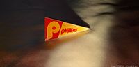 Front view of triangular Philadelphia Phillies pin