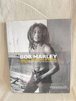 Front view of book with dust jacket featuring Bob Marley image