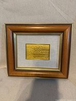 Frontal view showing entire framed artwork