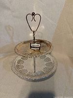 Full view of silver plated two-tier server