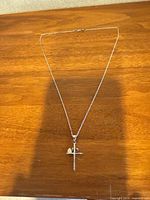 Full view of necklace laid out showing chain and pendants