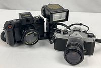 Akira 7000DVT camera with flash and Pentax SP500 SLR side by side