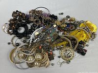Overview of entire unsorted jewelry pile