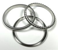 All three stainless steel Calvin Klein Jeans bangles overlapping