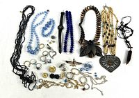 Full layout of necklaces, rings, earrings, bracelets, brooches and watch