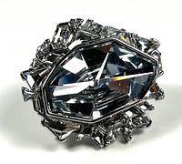 Front view showing large central faceted crystal and surrounding smaller crystals
