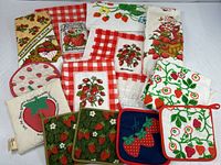 Group shot of all strawberry towels and hot pads