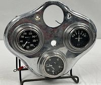 Front view of chrome cluster showing all three gauges