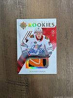 Front of Dominik Kahun Ultimate Rookies auto patch card showing autograph, patch window, and design