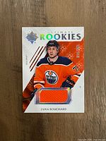 Front of Evan Bouchard Ultimate Rookies patch card showing jersey swatch