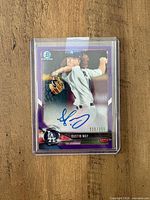 Front of 2018 Bowman Chrome Dustin May purple refractor rookie auto card in toploader