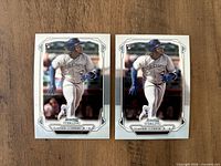 Two identical 2019 Bowman Sterling Vladimir Guerrero Jr. rookie cards on wooden surface