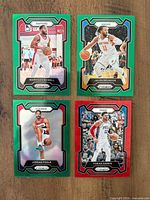 Four Panini Prizm basketball refractor cards showing fronts and colour borders