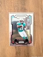 Front of 2023 Panini Prizm De'Von Achane rookie card in sleeve