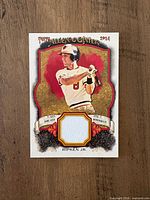 Front of card showing Cal Ripken Jr image, Allen & Ginter branding, jersey relic swatch
