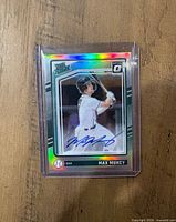 Front of holographic Max Muncy autographed trading card in plastic holder