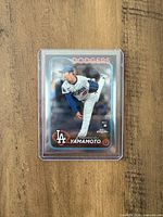 Front of 2024 Topps Chrome Yoshinobu Yamamoto rookie card in protective sleeve