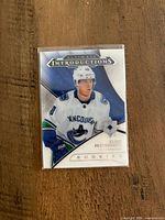 Front of Elias Pettersson Ultimate Introductions rookie card in sleeve