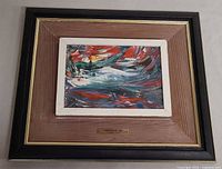 Overall view of framed painting with plaque visible