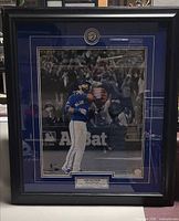 Front view of framed Jose Bautista photograph with plaque