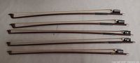 Five violin bows front view