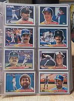 Binder page with eight Topps 1988 cards including Kevin Mitchell and Cal Ripken Jr.