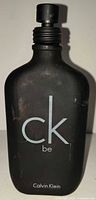 Front view of CK Be 6.7 oz bottle showing label and wear