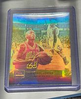 Front view of Michael Jordan hologram trading card in plastic sleeve
