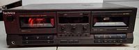 Front view showing two tape decks, controls and branding