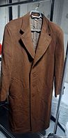 Front view of brown wool Canali Proposta top coat hanging on hanger