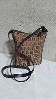 Front view of brown Fendi Zucchino canvas crossbody with strap