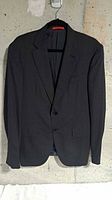 Front view of black Isaia blazer on hanger