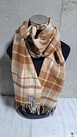 Full view of wool plaid scarf draped on mannequin