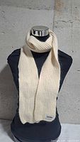 Full view of off-white rib-knit Varma scarf on mannequin