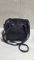Front view of black leather shoulder bag