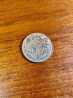 Reverse with Canadian coat of arms and date