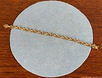 Full bracelet laid flat on circular pad