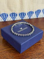 Bracelet displayed on top of blue Swarovski box