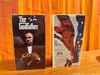 Front view of both VHS box sets standing upright