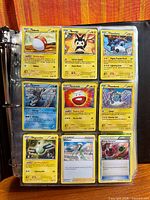Full binder page showing nine Pokémon cards including Voltorb, Emolga and Magnezone