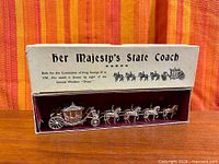 Full boxed set showing coach, horses and printed lid