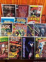 Front view showing all 12 magazine-size comics in rack