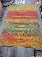 Full view of colorful abstract rug on floor