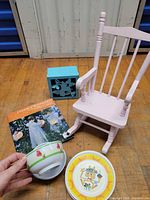 All items together: chair, box, book, bowl, plates