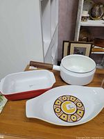 all three items grouped: saucepan, rectangular dish, oval dish