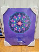 Front view sealed plaque-mounted abstract print with corner guards