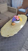 Top view of oval marble coffee table on patio