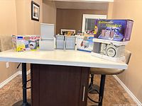 Full lot showing two boxed Aidata organizers, one loose organizer, boxed CP60 organizer, and speaker set in packaging